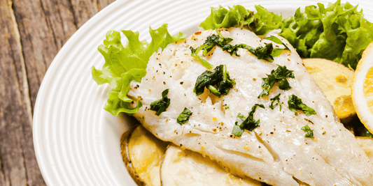 Reineta al horno con limón y hierbas